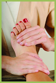 Woman receiving reflexology massage